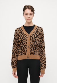 Leopard print cardigan in brown and black. Features a V-neck, button closure, and ribbed cuffs. Made from soft, textured fabric.