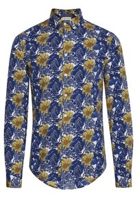 Camisa de botón con un patrón floral en amarillo y azul sobre un fondo blanco, con un cuello estructurado y mangas largas.