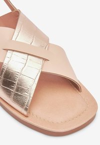 Next Sandaalit nilkkaremmillä - rose gold-coloured