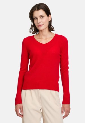 Roter V-Ausschnitt-Pullover aus weichem Strickmaterial, mit langen Ärmeln und geripptem Saum. Entworfen für eine taillierte Silhouette.