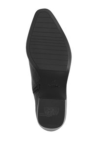 Suela de zapato negra con un patrón de agarre texturizado, con forma redondeada y acabado suave. Incluye la marca "Anti Slide" en la suela.