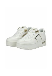 White platform sneakers with gold accents, perforated side panels, and secure laces, angled to show front and outer sides.