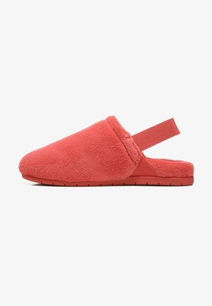 Coral slipper in soft, plush fabric with a back strap for secure fit. Features a flat rubber sole and a rounded toe design.