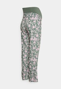 Maternity leggings in green with a pink floral pattern, featuring a wide, stretchy waistband and a fitted, tapered leg design.