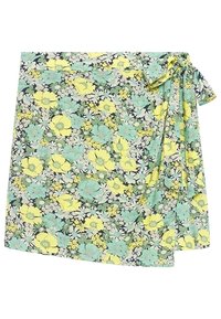 Jupe portefeuille florale en tissu léger présentant un motif de fleurs jaunes et turquoise sur fond bleu marine, maintenue par un lien.