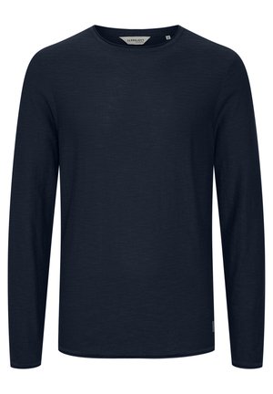 Tumed pikkade varrukatega T-särk, mis on valmistatud pehmest kangast, ümmarguse kaelusega ja sirge helmega. Minimalistlik disain, ilma mustrite või aktsentideta.