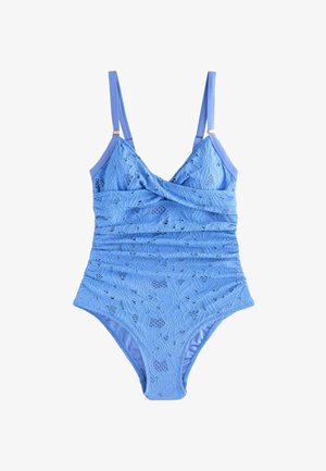 Mėlynas vientisas maudymosi kostiumėlis su reguliuojamomis petnešėlėmis ir gėlių nėrinių viršutine dalimi, priekyje dekoruotas su raukiniais.