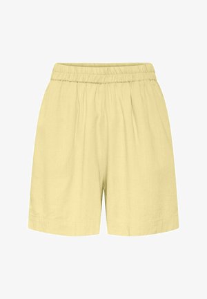 Svetložlté, voľné kraťasy s elastickým pásom a jemnými švami, navrhnuté pre bežné nosenie.