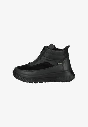 Las botas de tobillo negras presentan una combinación de cuero liso y texturizado, con una cremallera lateral y una suela robusta. Forradas con material suave para mayor calidez.