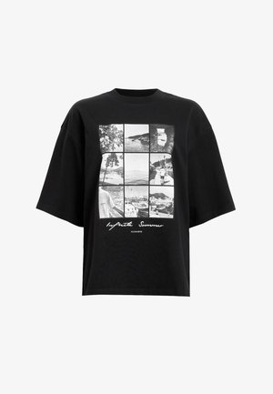 Black oversized t-shirt featuring a grid of black-and-white photographs on the front with the text "Infinite Summer" below.