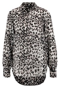 Leopard print blouse in black and cream, featuring a collar, button front, and long sleeves with elastic cuffs. Soft, lightweight fabric.