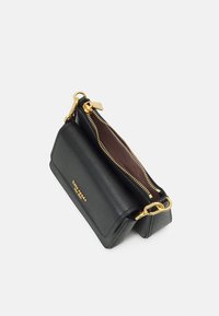 Black leather crossbody bag with a textured finish, gold hardware, and a zip closure. Interior features a brown lining.