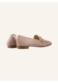Pink suede loafers with a rounded toe, gold hardware detail, and a low stacked heel, featuring a smooth texture and clean lines.