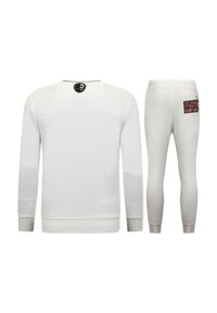 Witte sportieve sweatshirt met lange mouwen en geribbelde boorden, gecombineerd met witte legging met een grafische tekstdetail op de achterkant.