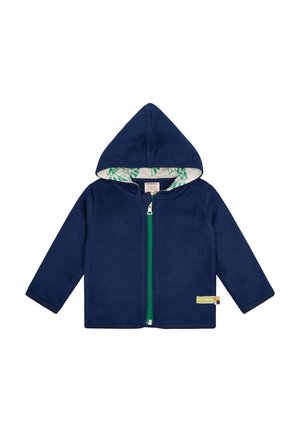 Marineblaues Fleece-Hoodie mit Reißverschluss, grünem Reißverschluss und einem gemusterten grün-weißen Innenfutter. Verfügt über lange Ärmel und eine Kapuze.