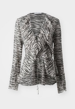 Prozirna bluzica s dugim rukavima koja ima uzorak crno-bijelih pruga zebera, s drapiranim prednjim dijelom, detaljem za vezanje i uskim manžetama.