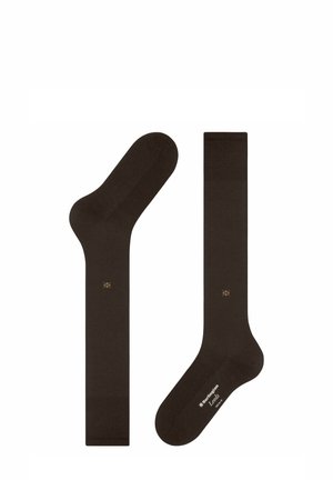 Braune Socken aus weichem Material, mit glatter Textur, standardmäßiger Form und einem kleinen goldenen Logo-Detail an der Seite.
