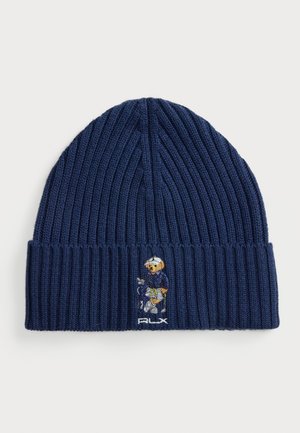 Marine gebreide beanie met ribbels en een omgeslagen rand, voorzien van een geborduurd figuur en het 'PLX' logo aan de voorkant.
