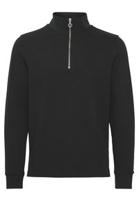 Black pullover with a high collar, featuring a silver zipper at the neck. Long sleeves with cuffed ends, made from a smooth, textured fabric.