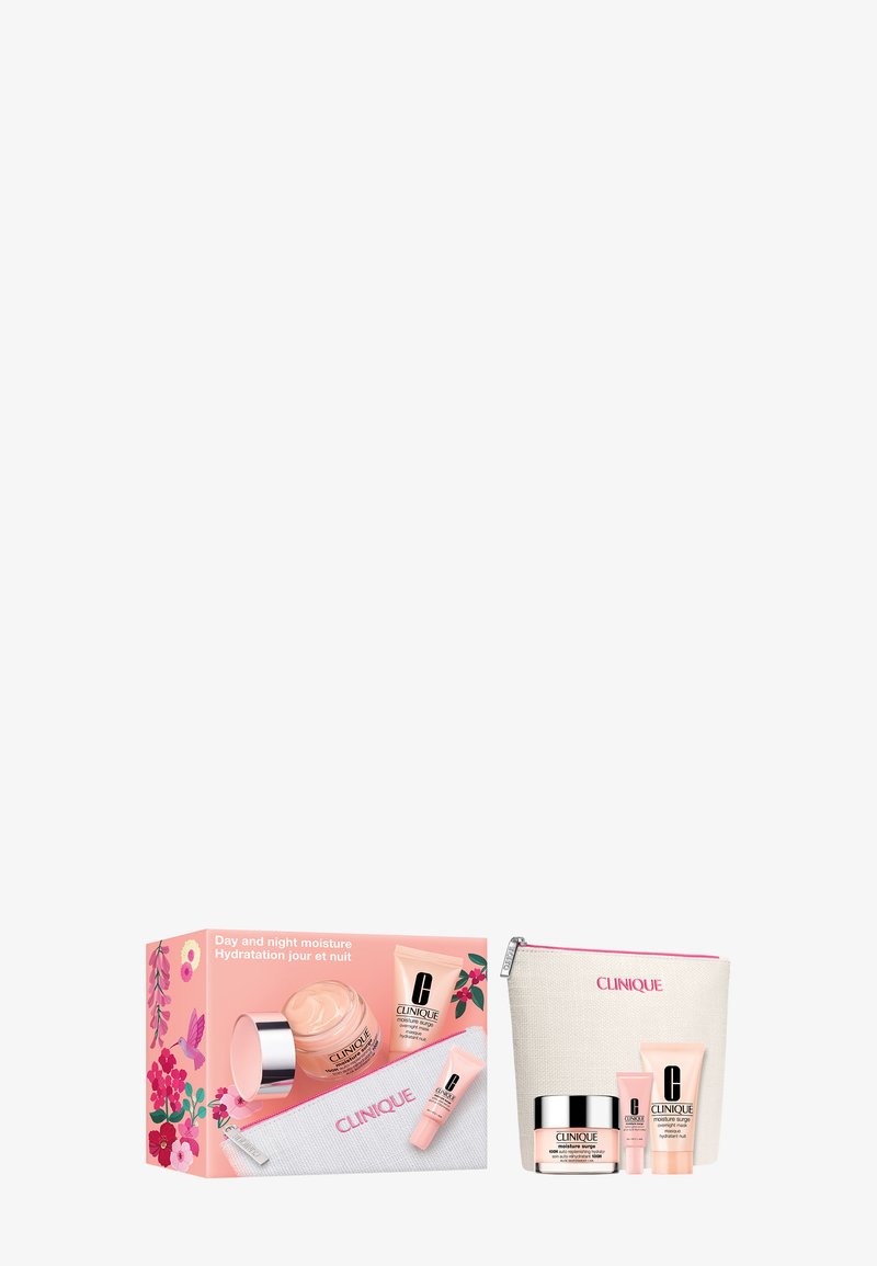 Clinique Day and Night Moisture skincare set with cream jar, tube, small balm, and white zip pouch with pink logo and floral box design.