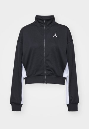 Black cropped athletic jacket with high collar, zip closure, and white side panels. Features a small logo on the chest area.