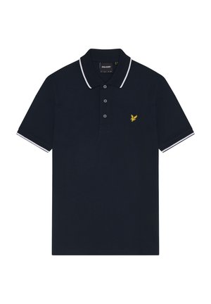 Mørkeblå polo skjorte lavet af bomuld med tre-knaps lukning, hvidt kantbånd på kraven og ærmerne, med et lille gult ørne-logo på brystet.