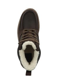 Brun læderankelstøvle med tyk hvid imiteret pelsforing, snøredesign og en trække-flig bagpå for nem påtagning.