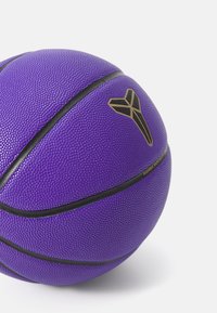 Purple basketball with textured surface, black accents, and a gold logo. Features traditional shape and two black horizontal stripes.
