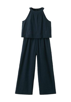 Combinaison sans manches bleu marine texturée avec un col montant, des jambes larges et des détails floraux brodés subtils au-dessus de la taille.