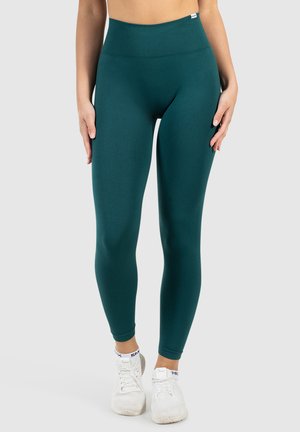 Hooggewaist teal leggings gemaakt van rekbare stof, met een gladde textuur en een naadloos ontwerp voor een slanke pasvorm.