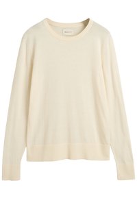 Maglione a maniche lunghe di colore crema realizzato in un tessuto morbido, con scollatura rotonda e polsini e orlo a costine. Design semplice e senza decorazioni.