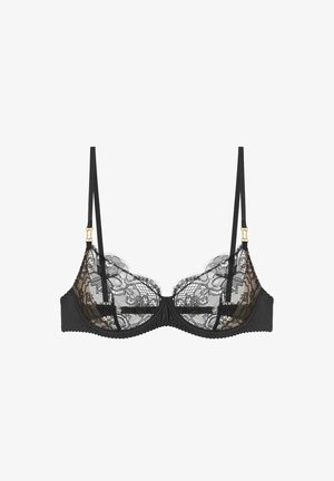 Black bra featuring a lace overlay with floral patterns, adjustable straps, and gold-tone hardware on the shoulder straps.