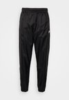 M NK WR WVN LND   - Pantalon de survêtement - black/white