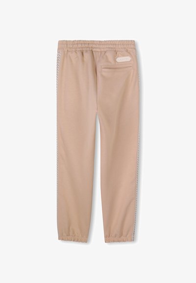 Lichtbeige sweats met een elastische tailleband, zijzakken en een gestructureerde witte streep langs de zijkanten. Glad materiaal en tapered leg ontwerp.