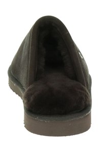 Zwarte suède pantoffel met een ronde, open teen en een zachte bontvoering. Voorzien van een rubberen zool en subtiele stikdetails.