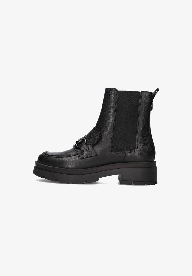 Black ankle boot made of textured leather with elastic side panels, decorative buckle, and chunky rubber sole. Flat heel with grip details.