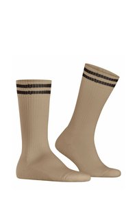 Calzini beige a coste con un design uniforme e accenti a righe nere nella parte superiore. Realizzati in un tessuto liscio e elastico.