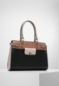 Structured handbag with black, pink, and cream panels, gold hardware accents, and dual top handles. Smooth leather texture.