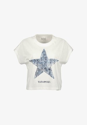 White cropped t-shirt with a blue star design made of textured fabric, featuring the word "VACANCES" in bold at the bottom.