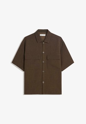 Korte mouwen, donkervogel shirt van textuurstof. Voorzien van een knoopsluiting aan de voorkant en twee borstzakken. Casual ontwerp met een relaxte pasvorm.