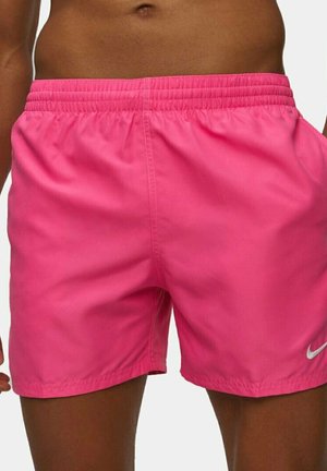 Shorts sportivi rosa con vita elasticizzata, realizzati in tessuto liscio. Presentano un piccolo logo Nike bianco sul lato destro in basso.