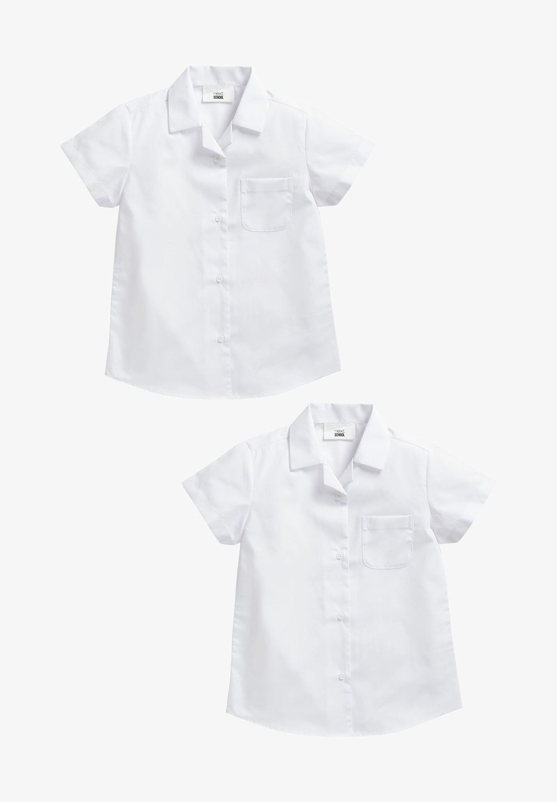 Valge lühikeste varrukatega nööpidega särk, millel on kaelus, üks rindade tasku ja kõver äär. Sile puuvillane kangas. Minimalistlik disain.