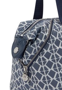 Navy patterned handbag with geometric design, featuring a silver zipper and button detail, made from durable fabric with a smooth texture.