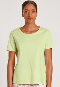 Lichtgroene T-shirt met korte mouwen, ronde halslijn en een gladde textuur. Minimalistisch ontwerp, geschikt voor casual kleding.