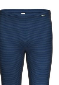 Dunkelblaue Leggings mit horizontalen Streifen, aus elastischem Material gefertigt. Verfügt über einen glatten Bund und ein dezentes Logo-Detail.