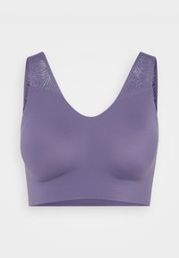 Lilla sportsbh lavet af et glat, strækbart stof. Har brede stropper og en tekstureret meshpanel på ryggen. Sømløst design for komfort.
