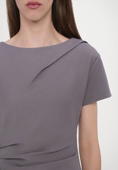 Short-sleeve, lavender gray dress with a boat neckline, featuring a draped detail across the shoulder and smooth, textured fabric.