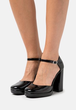 UNAA - Scarpe con plateau - black