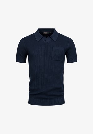 Polo shirt a maniche corte in maglia blu navy con colletto e taschino sul petto, caratterizzato da una trama a coste e un'etichetta di taglia media all'interno.