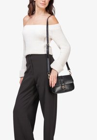 Miriade Borsa a mano - nero